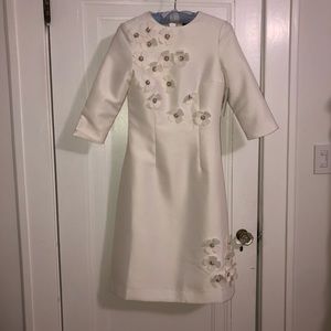White dress with floral appliqué